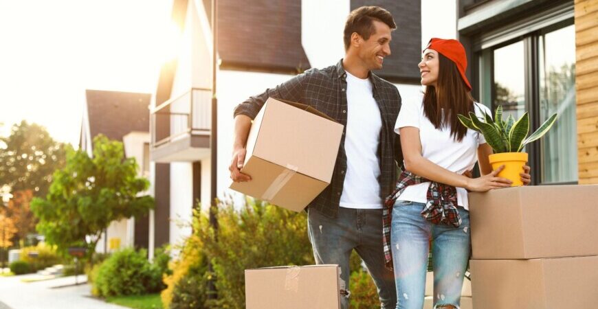 Residential moving services by Great Toronto Movers. Happy couple moving into their new home.