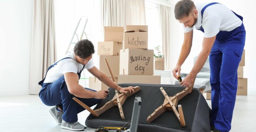 Great Toronto Movers. Home, and office furniture assembly services Toronto. Professionalism, and peace of mind. Two men assembling a couch.