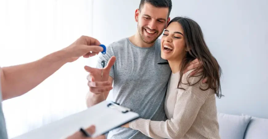 A young couple moving into their new condo with the help of professional condo movers.