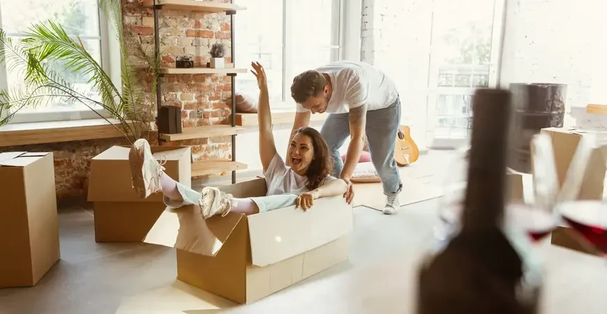 A young couple enjoys peace of mind with Best-In-Class insurance for their condo move.