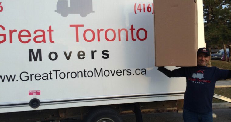 Great Toronto Movers. Labour only moving services. Mover holds up wardrobe box.