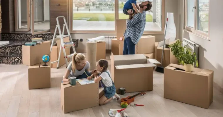 Residential moving solutions by Great Toronto Movers. A happy family unpacking after a smooth move.